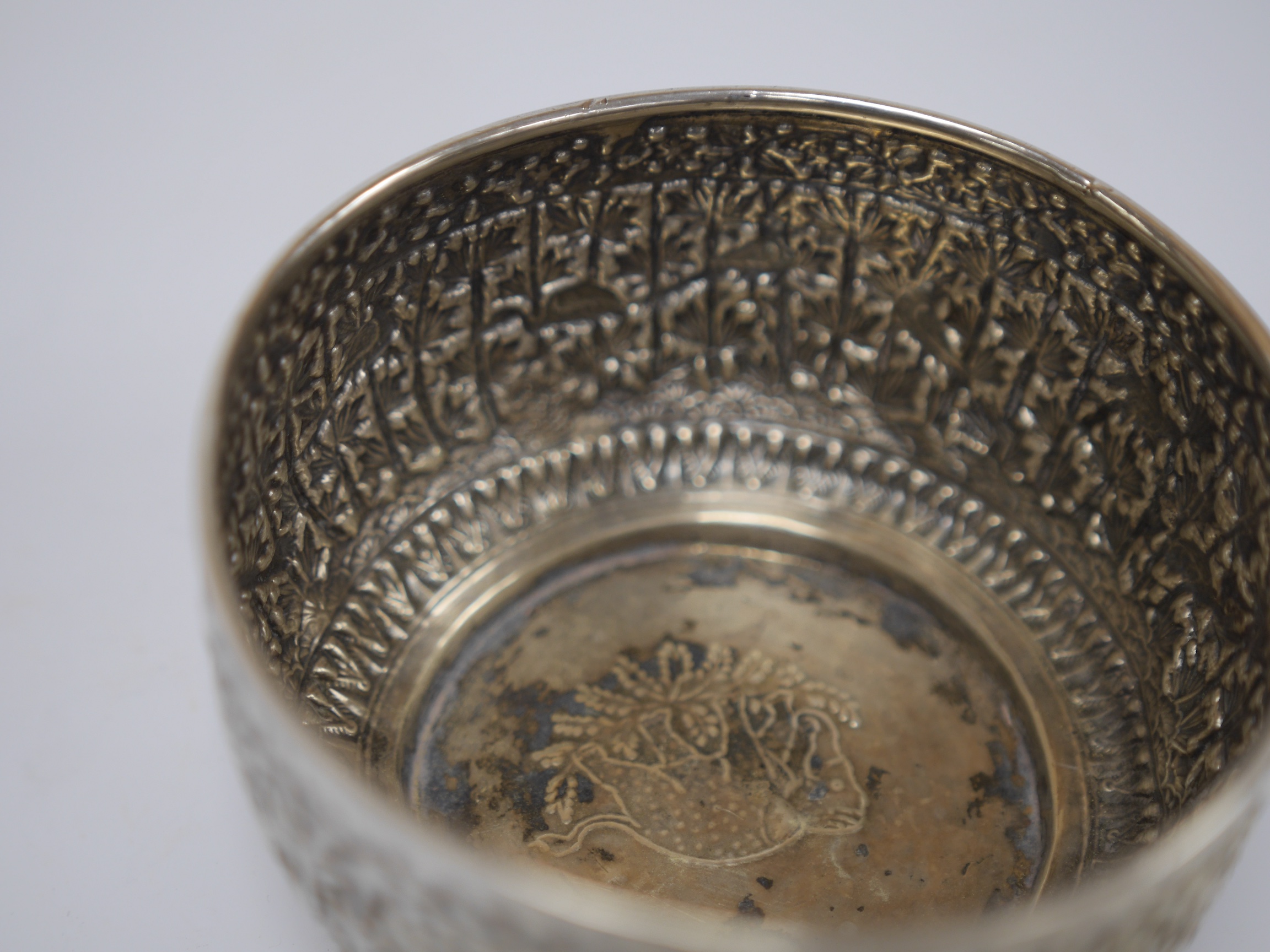 A late Victorian Scottish embossed silver bowl, in the Burmese style, David & George Edwards, Glasgow, 1893, diameter 11.2cm, 4.8oz. Condition - poor to fair